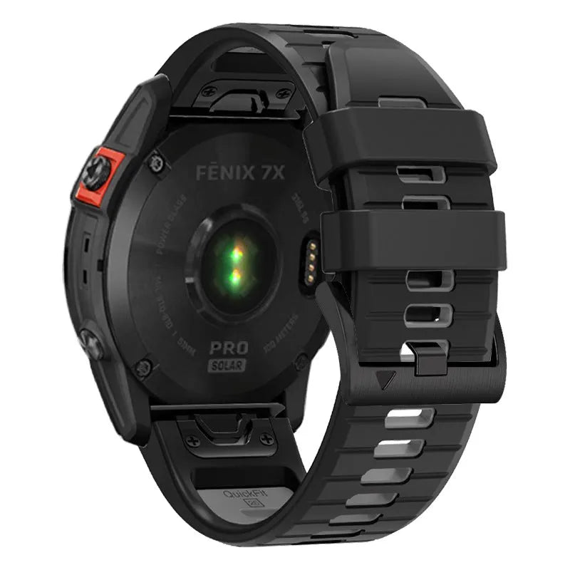 Two-tone quick release silicone watch strap for Garmin Fenix smartwatch on a grey background.