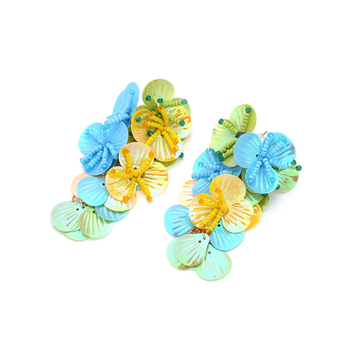 Close-up of handmade colourful string bead flower and leaf earrings in exaggerated dopamine style.