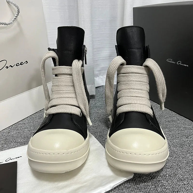 Men's and women's black high-top leather sneakers with a side zipper and round toe on a rubber sole.