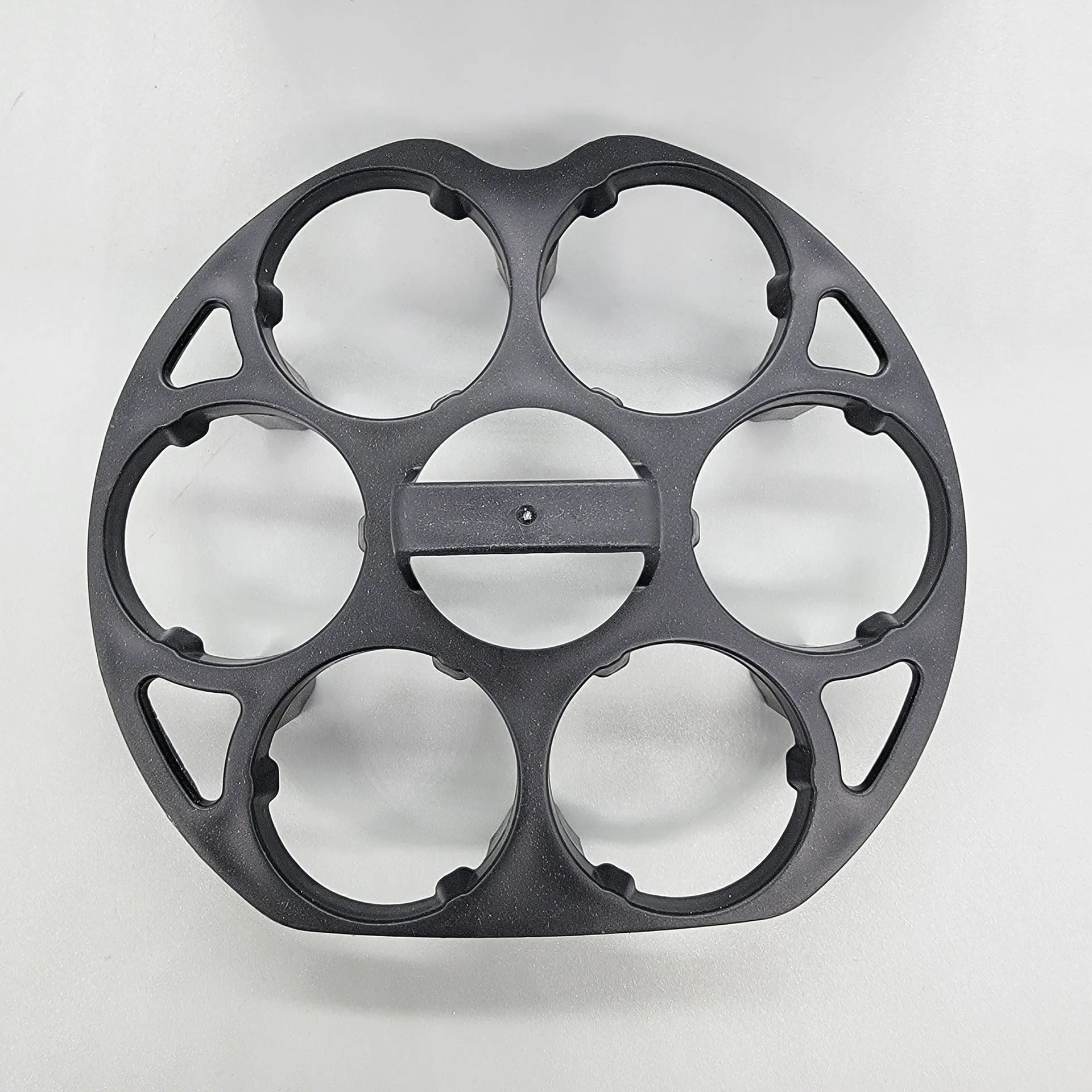 Black plastic egg holder for cooking machines measuring 13.8 by 12.6 by 5.7 cm