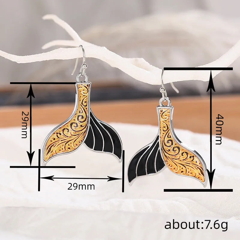 Women's fishtail earrings with whale motifs in white gold colour alloy jewellery