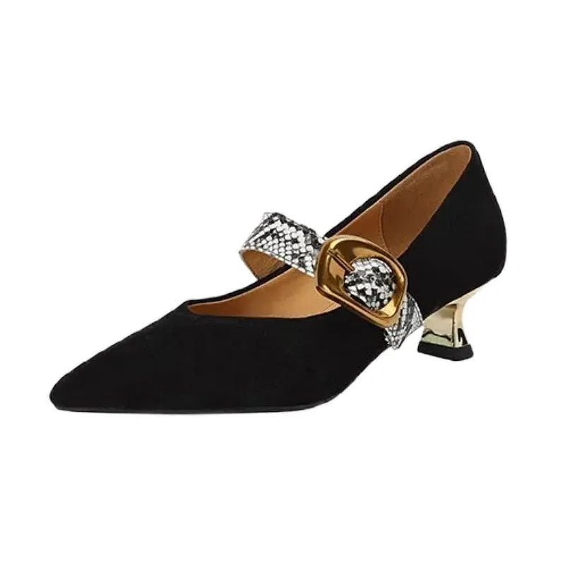 Black women's pointed toe stiletto heels with an ankle buckle fastening on a white background.