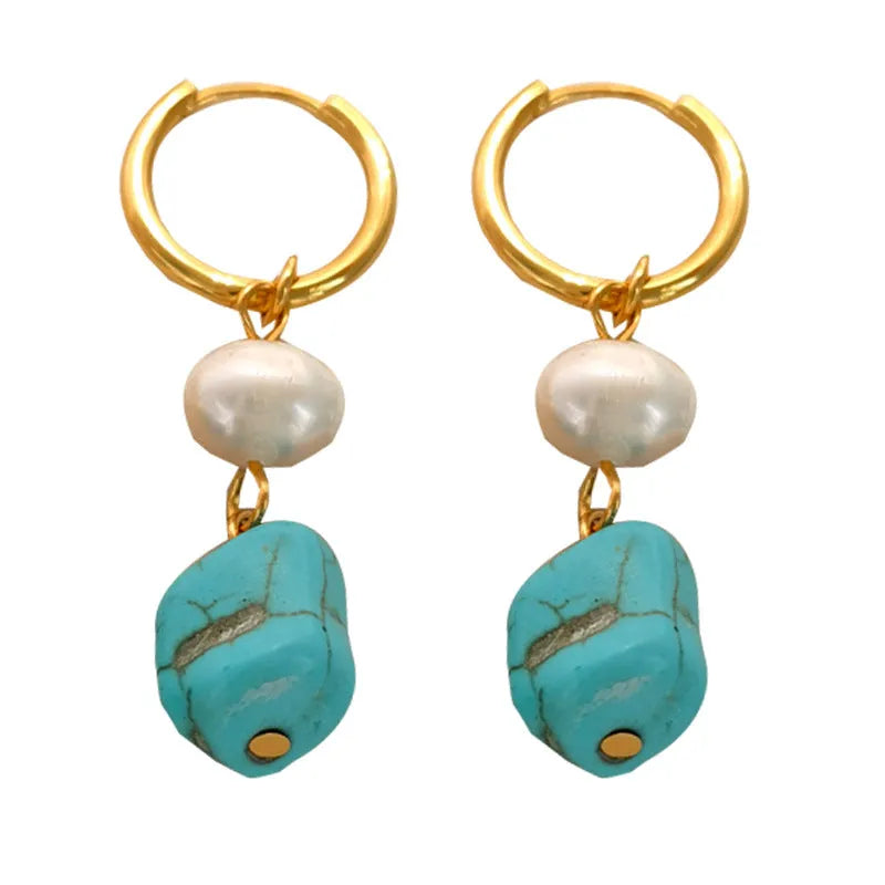 A pair of geometric copper earrings with irregular turquoise stones and cultured pearls
