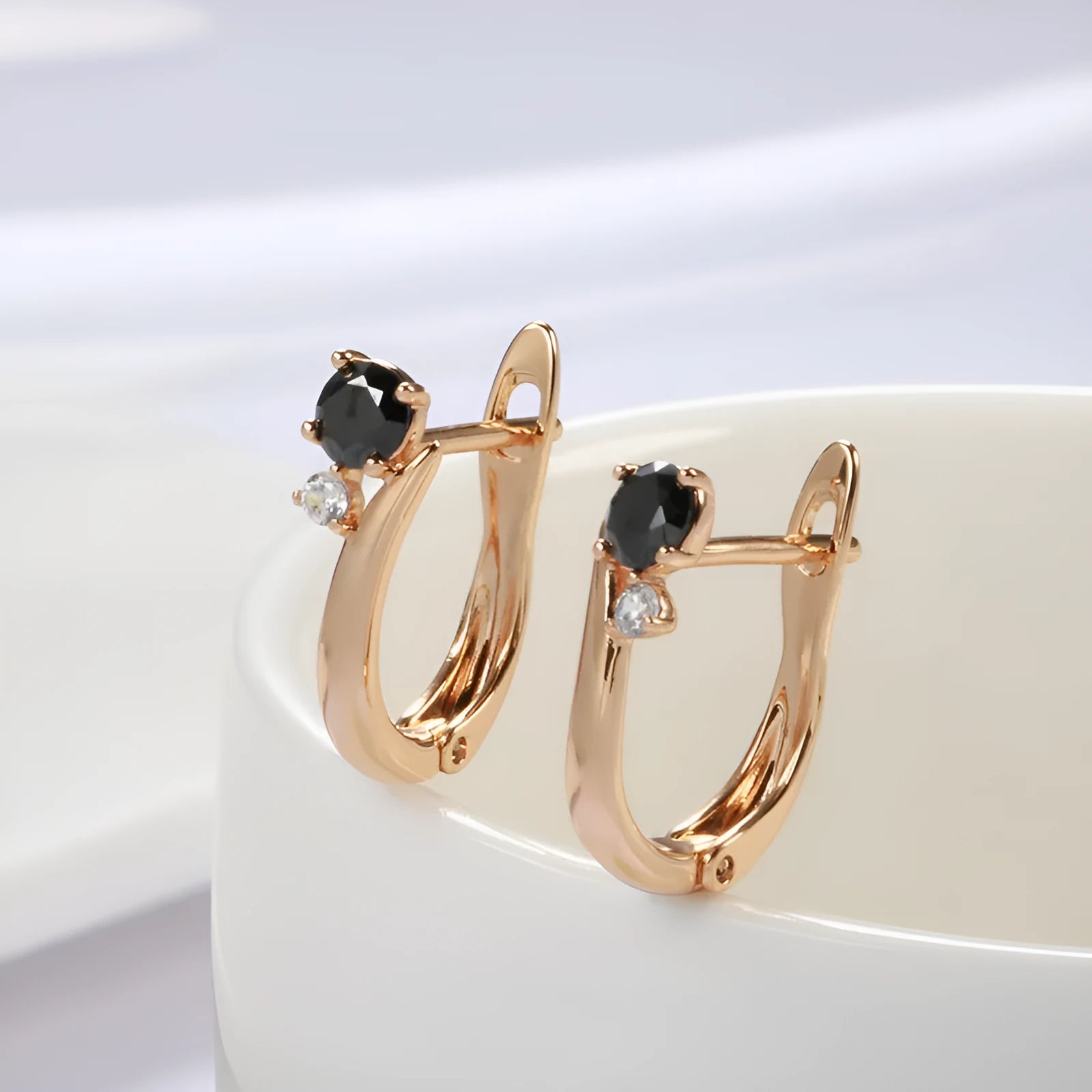 Gold geometric drop earrings with black agate stone accents and retro design