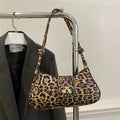 Large casual women's PU leather handbag with outer sandwich pockets in black, brown, coffee, or khaki.