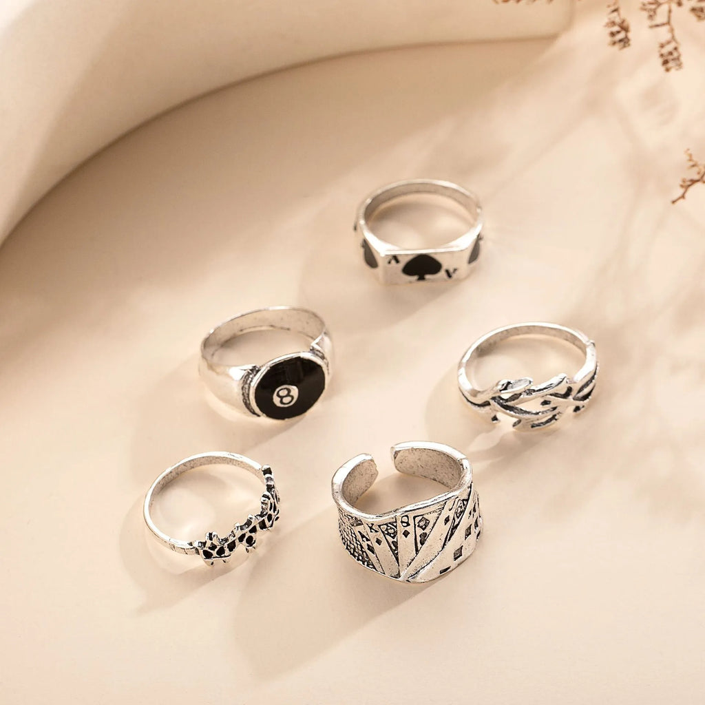Black alloy poker ring with retro spade card design for female wearers