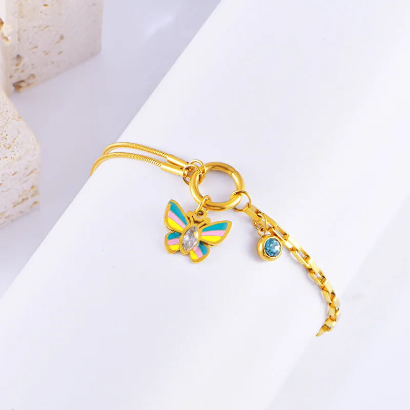 Gold titanium steel jewellery set with colourful epoxy butterfly pendant designs
