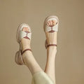 Women's khaki platform sandals with chunky heels and open toe design showing renewable leather uppers
