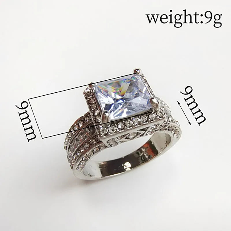 Silver-toned geometric women's ring with round elements in gold or white electroplated finish