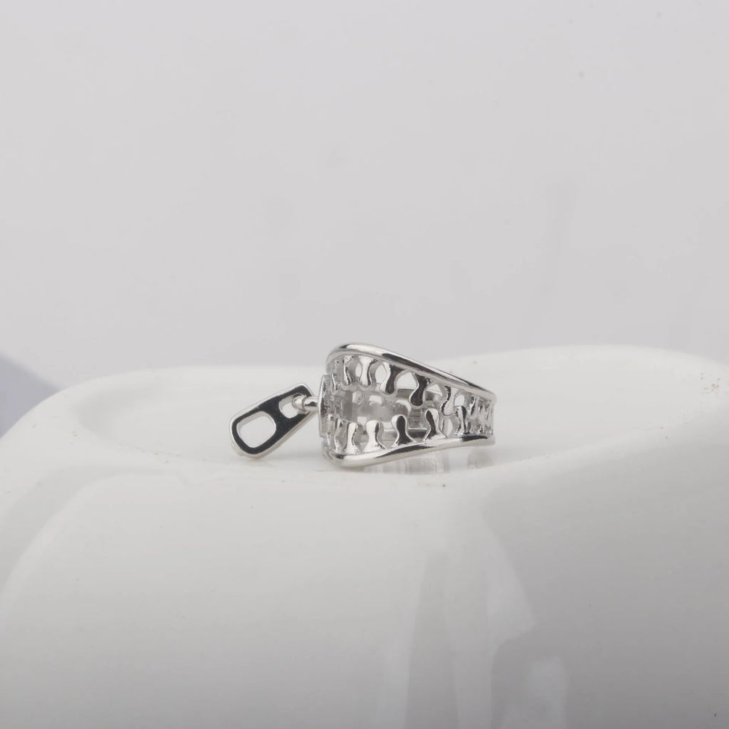 Copper geometric ear clip with zipper design detail and simple line elements