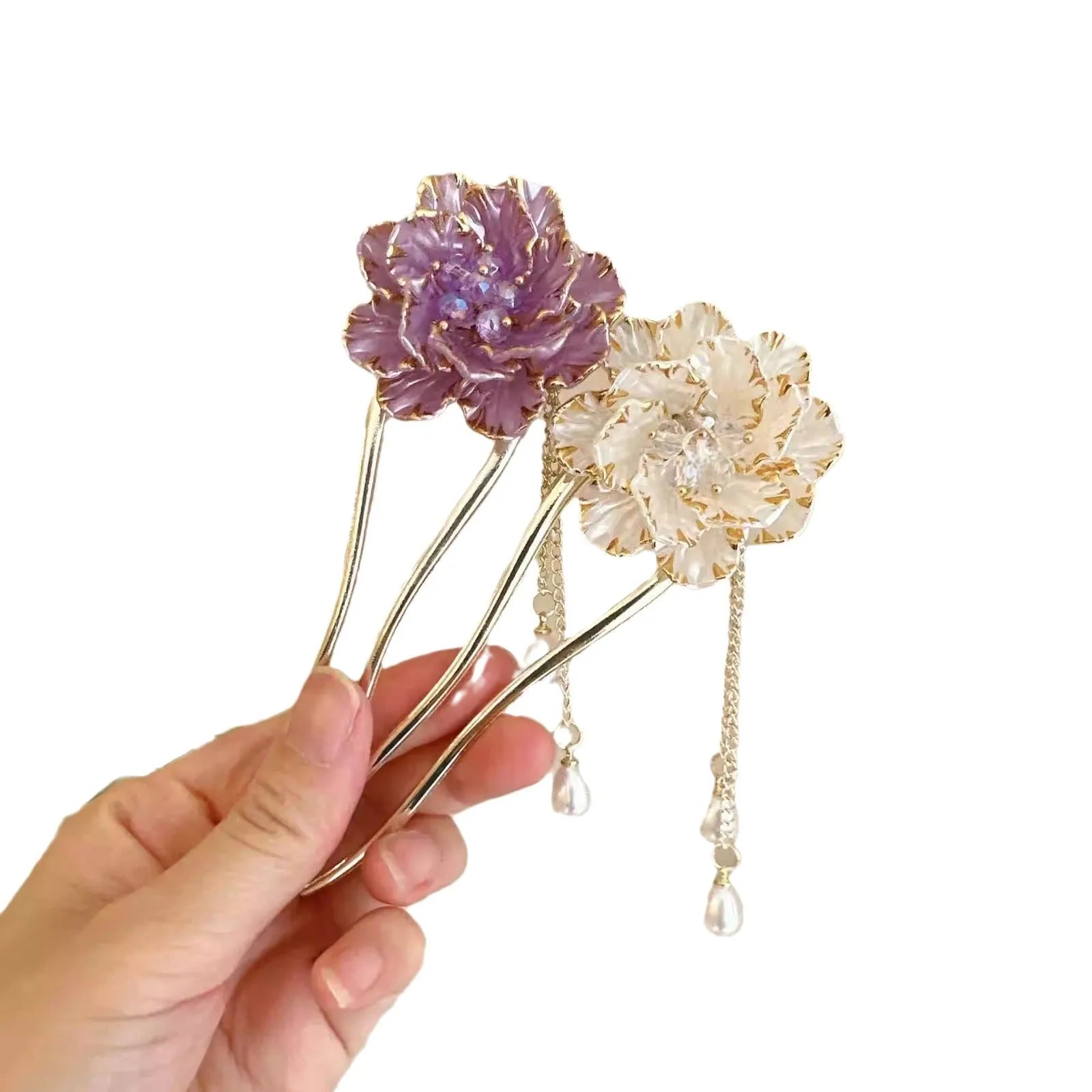 Close-up of a purple U-shaped alloy hairpin with a peony flower and tassel decoration.