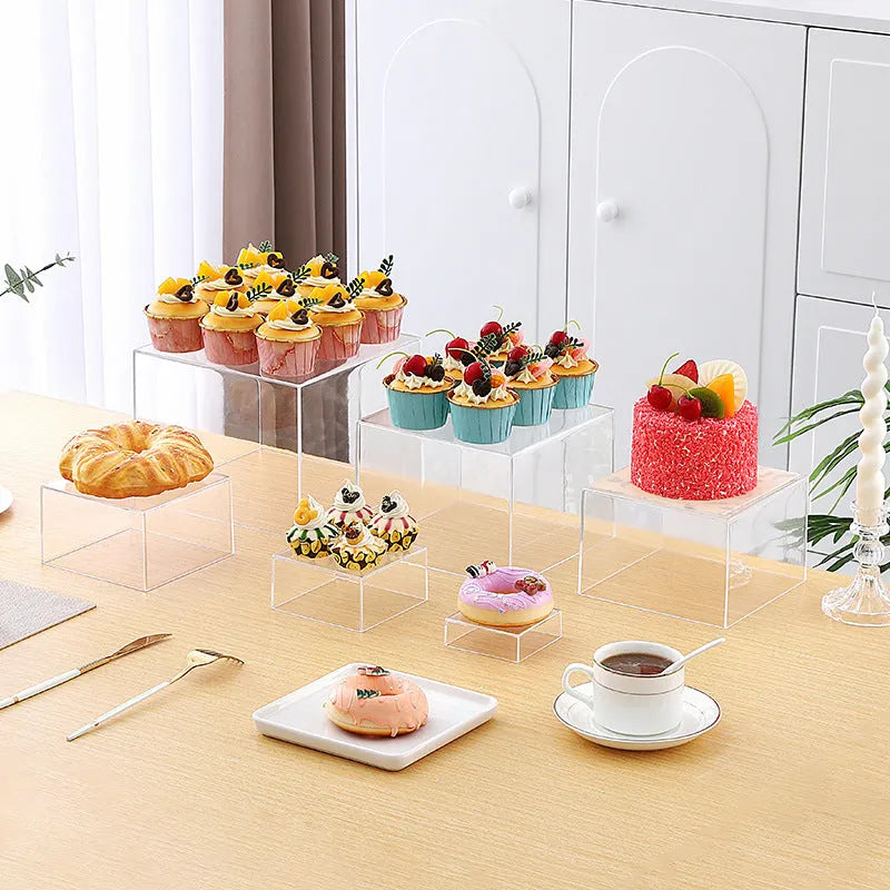 White plastic dessert display stand with six stacking cubes for tiered cake and dessert presentation