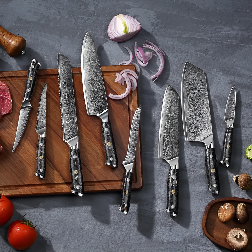 Damascus steel kitchen knife set showing eight knives with fishbone pattern blades, including chef, boning, and fruit knives.