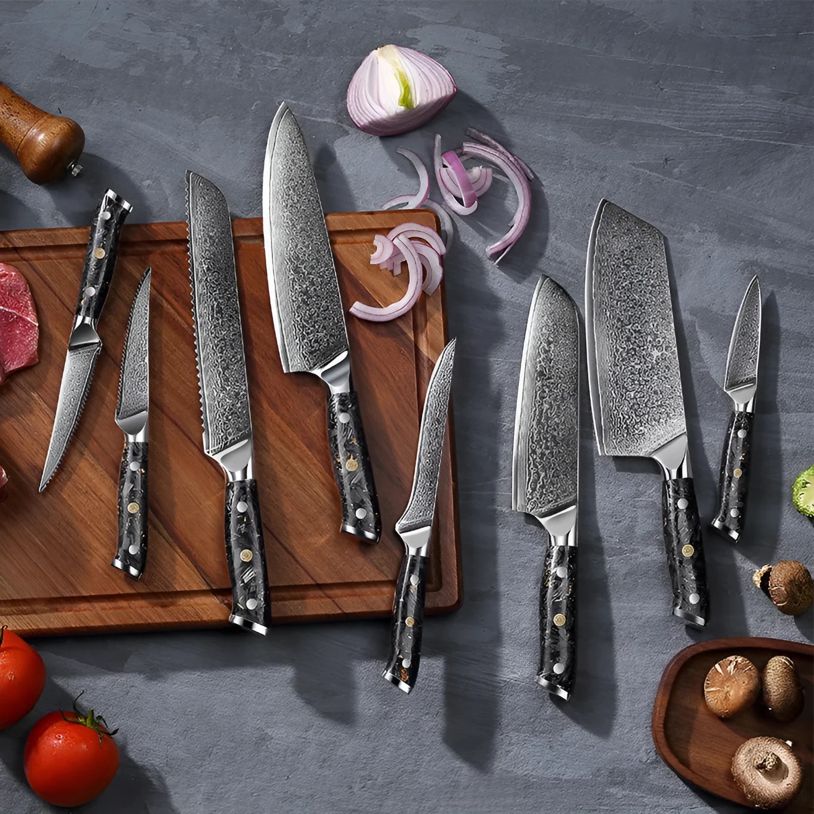 Damascus steel kitchen knife set showing eight knives with fishbone pattern blades, including chef, boning, and fruit knives.