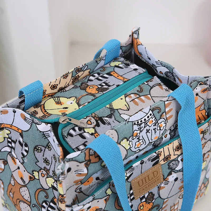 Women's printed canvas handbag with aluminium frame in horizontal square shape