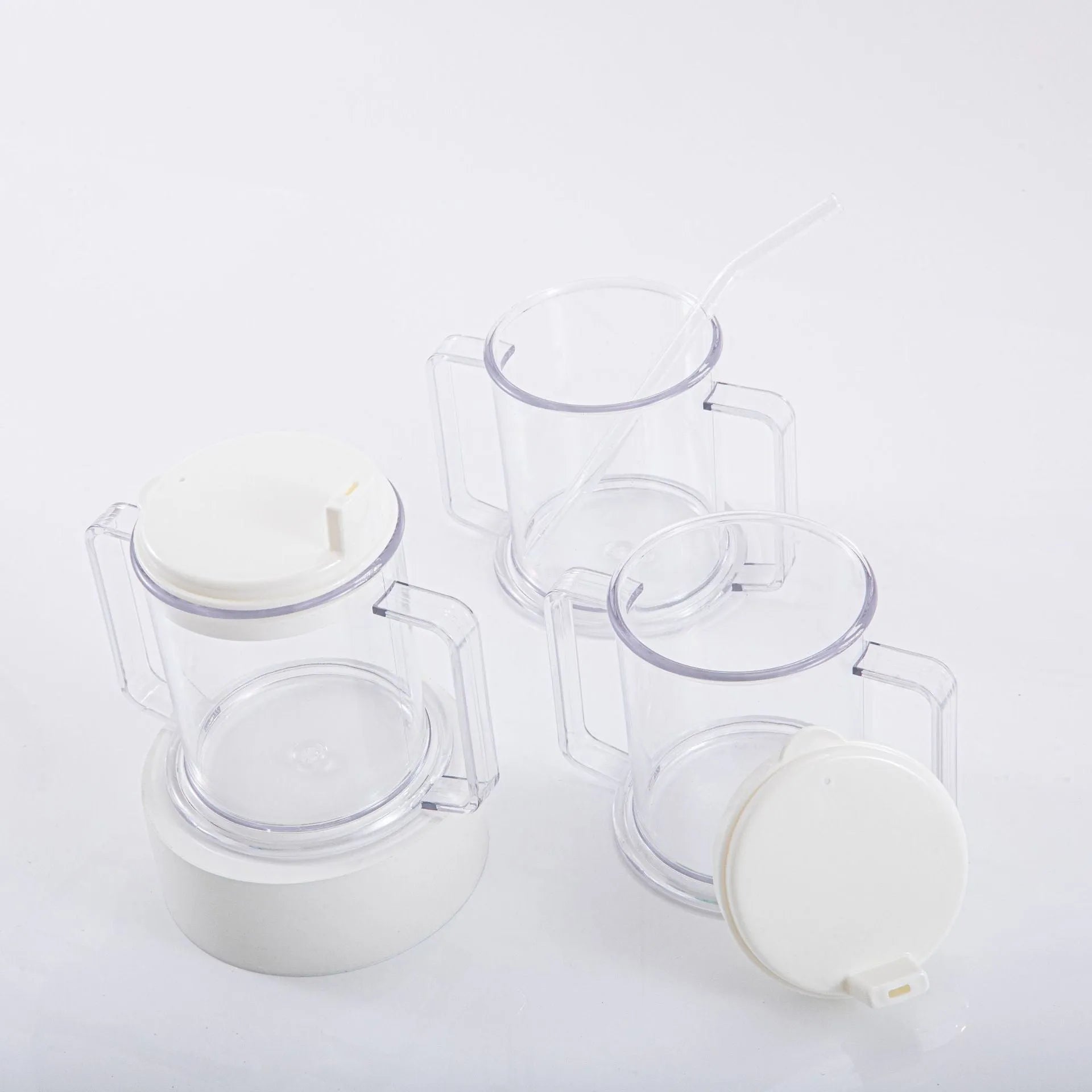 Transparent plastic spill-proof drinking cup on a table.
