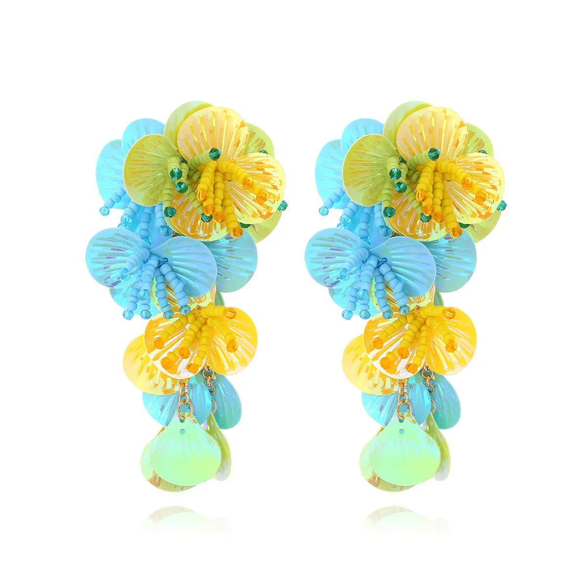 Close-up of handmade colourful string bead flower and leaf earrings in exaggerated dopamine style.