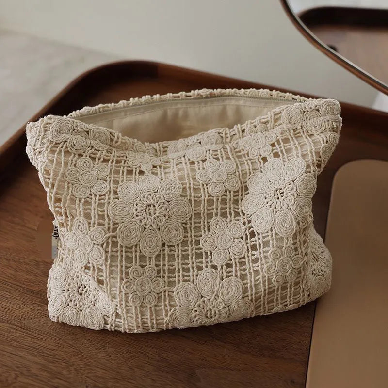 Handmade corduroy cosmetic bag with crocheted hollow flower pattern and ethnic embroidery