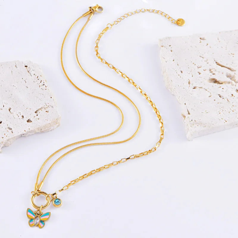 Gold titanium steel jewellery set with colourful epoxy butterfly pendant designs