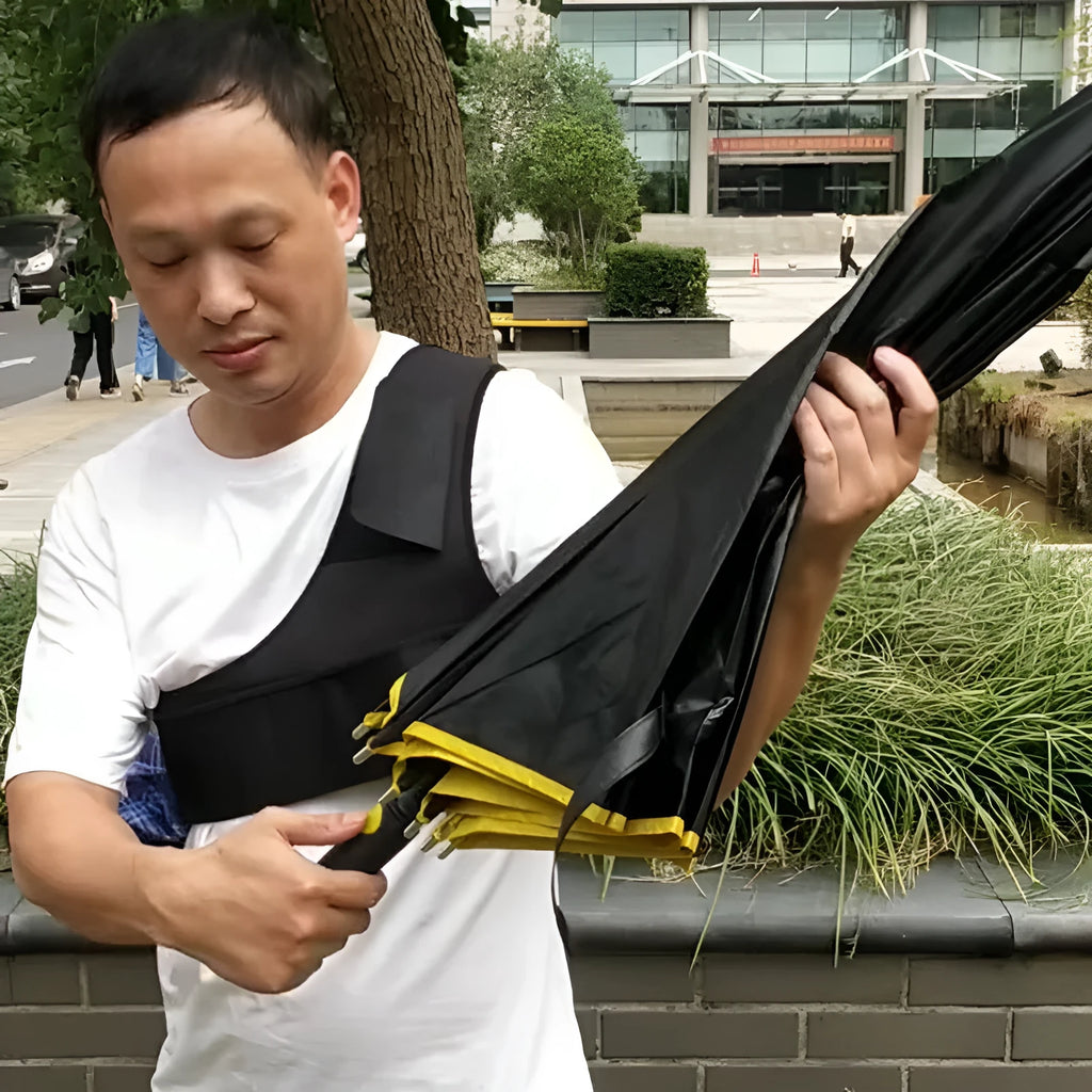 Black portable umbrella holder with shoulder strap for hands-free use with a manual umbrella.