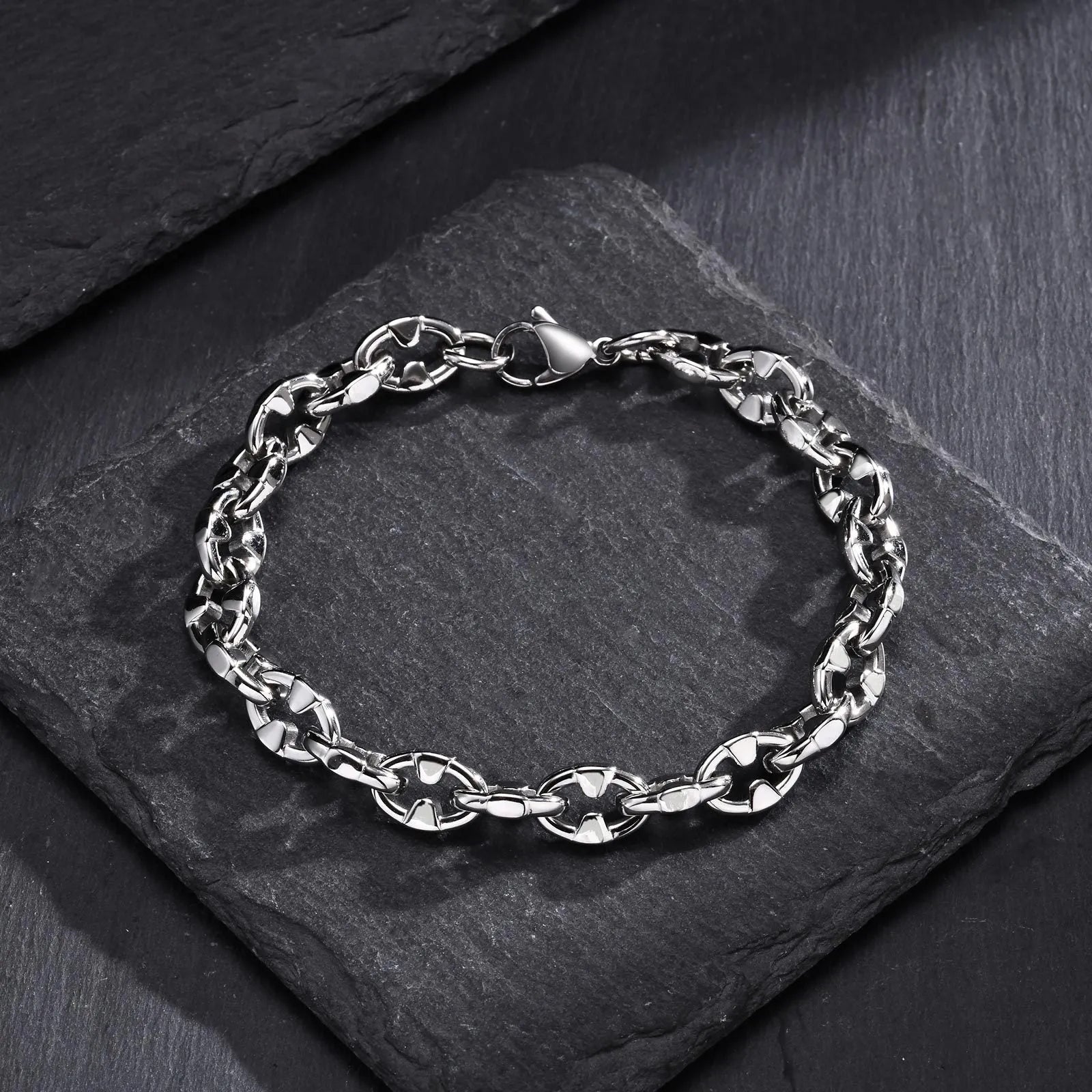 Handmade thick stainless steel chain bracelet with geometric links and a clasp, shown in a steel colour.