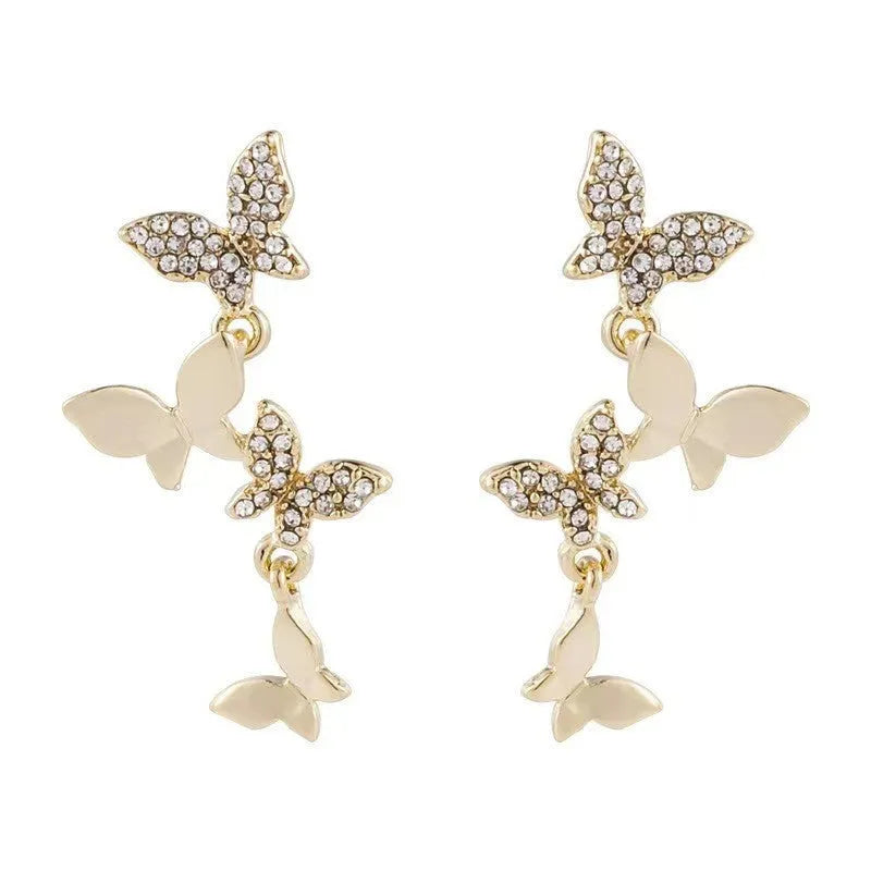Women's gold tone copper butterfly drop earrings with four butterfly designs