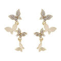 Women's gold tone copper butterfly drop earrings with four butterfly designs