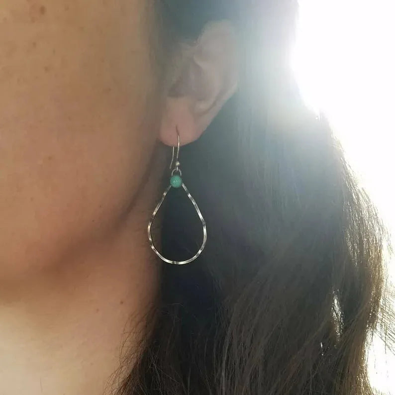 Circular turquoise earrings in antique silver with bohemian geometric design