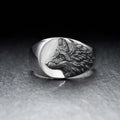 Men's geometric wolf head alloy ring in silver colour on a size guide showing UK sizes 6 to 12.