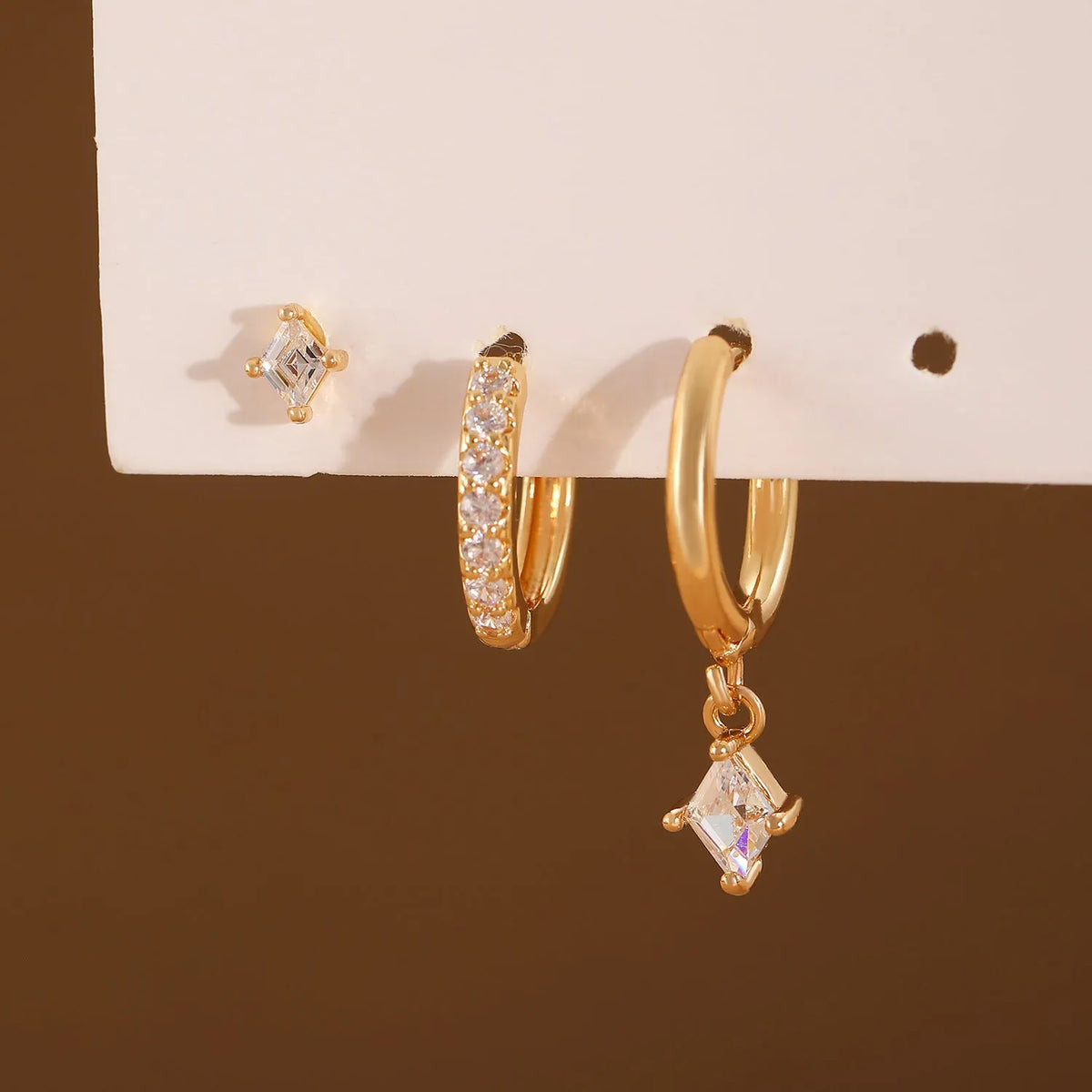 Ladies copper jewellery set with three geometric zircon pieces in gold or white