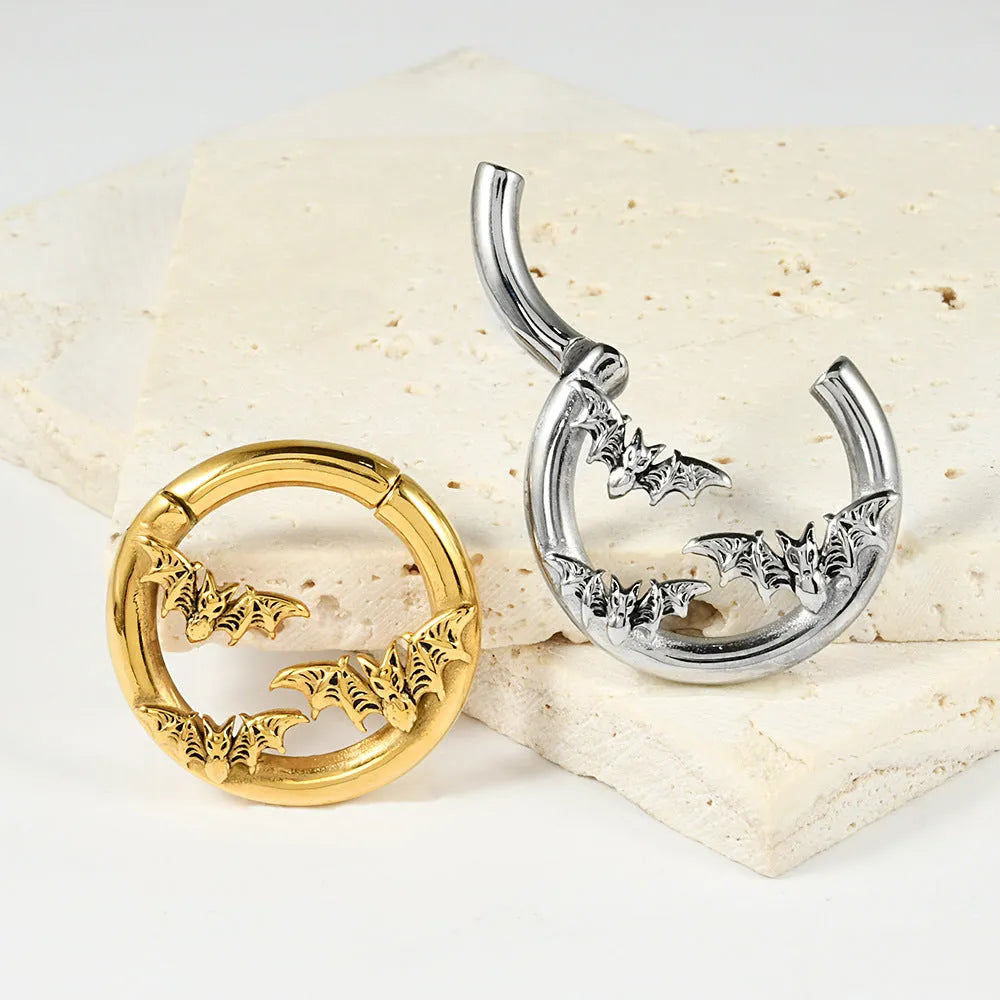 A pair of silver fashion earrings with a raised totem pattern, shown in one of 15 available electroplated colour finishes.