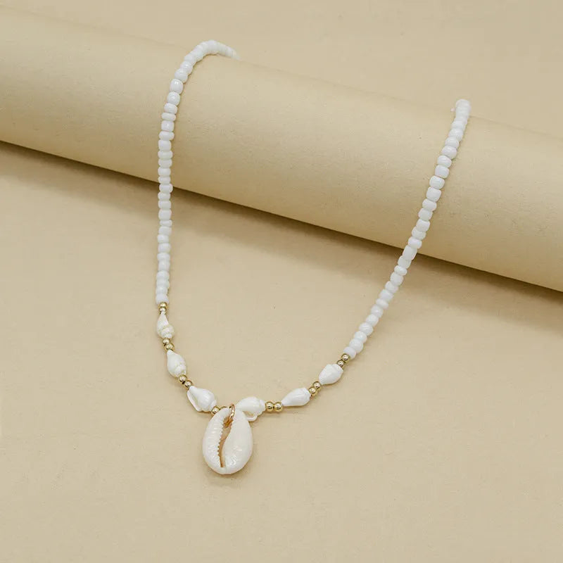 White electroplated conch shell bead necklace with mother pearl shellfish pendant