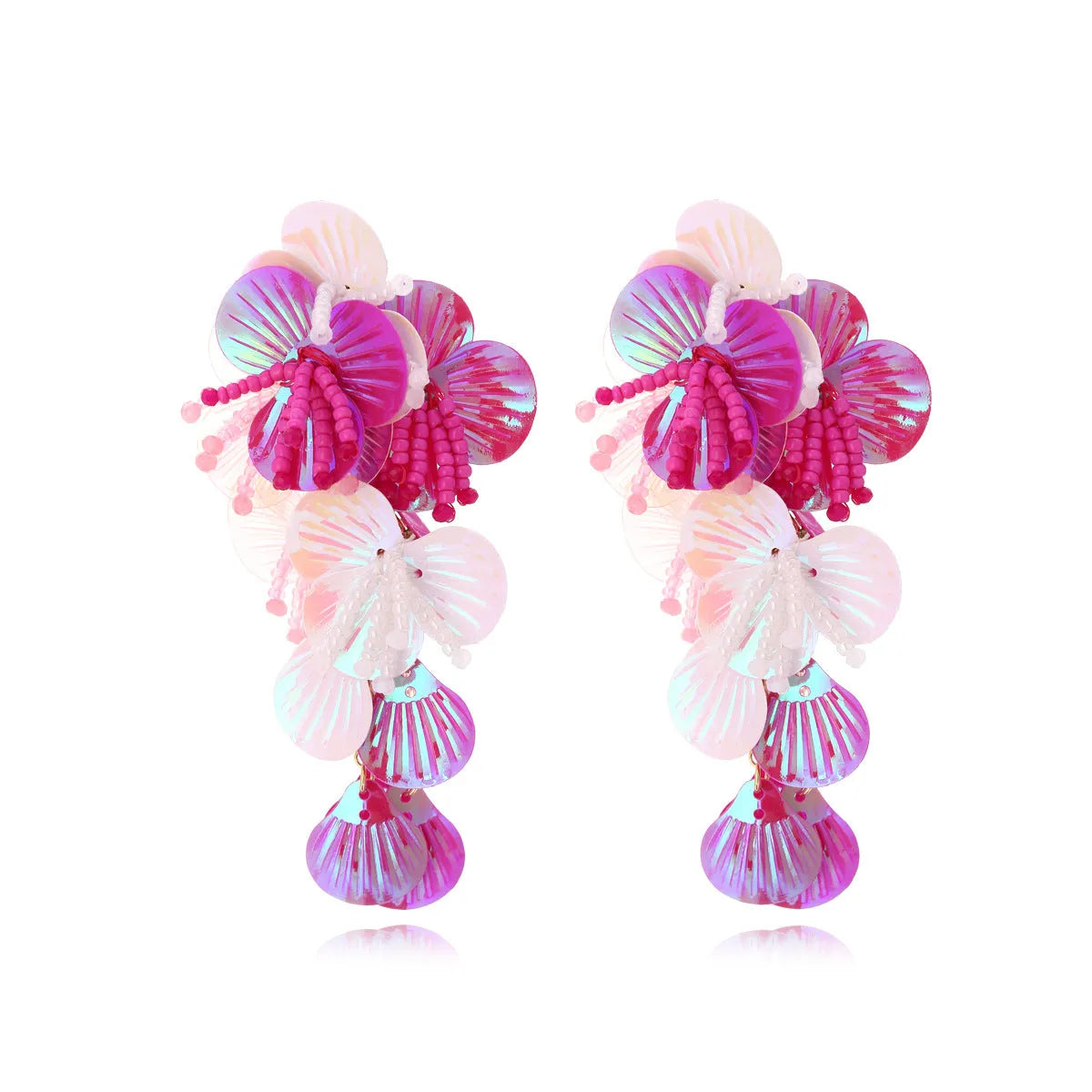 Close-up of handmade colourful string bead flower and leaf earrings in exaggerated dopamine style.