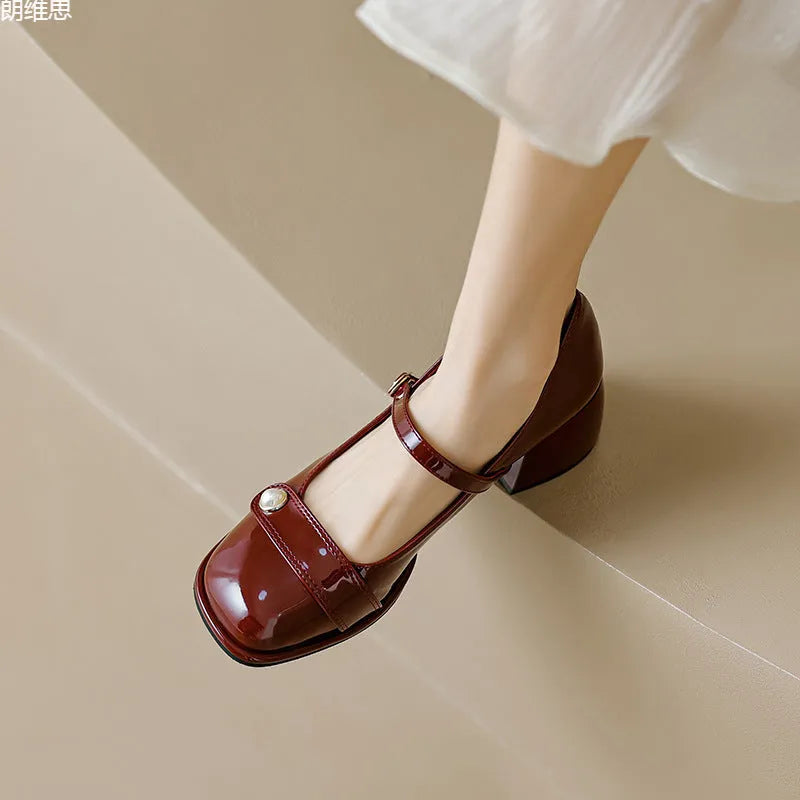 Patent leather chunky heel ankle boots with square toe and buckle fastening in apricot colour