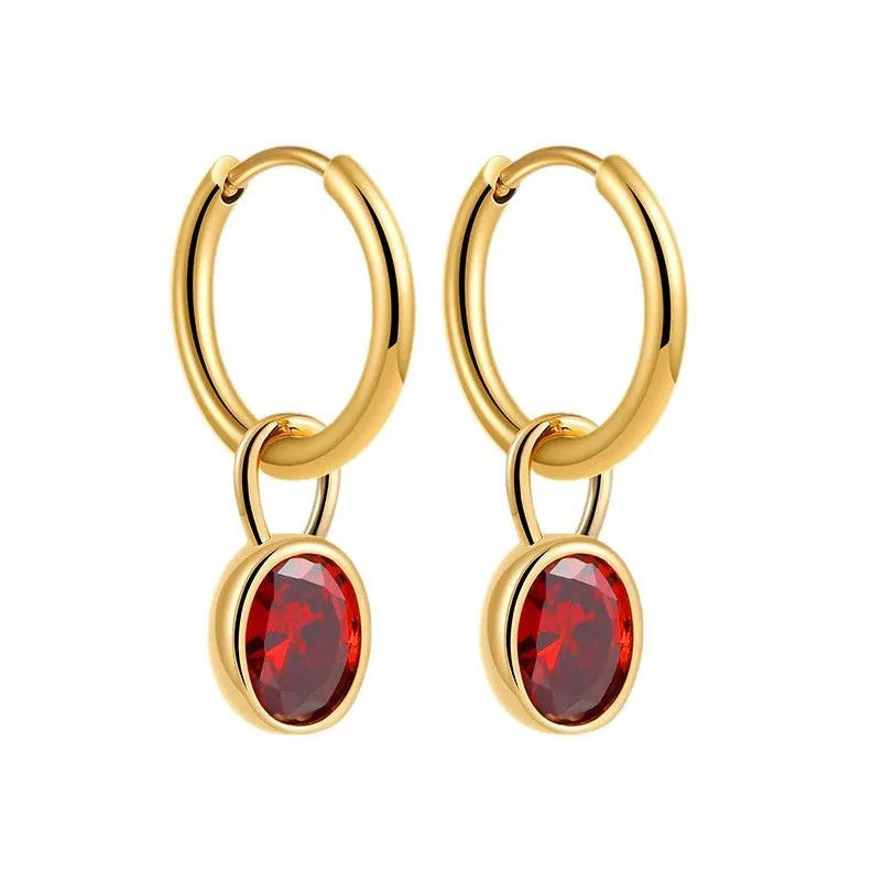Close-up of women's retro oval zircon earrings in copper setting, showing ellipse design.