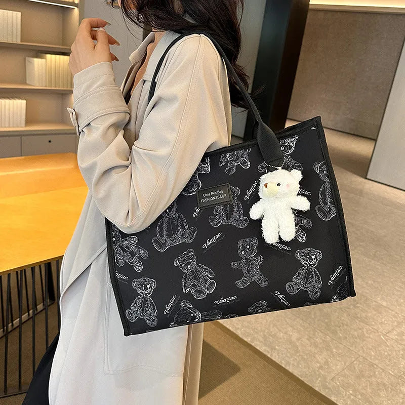 Printed canvas tote bag with rhombus pattern and sandwich pocket design in black colour
