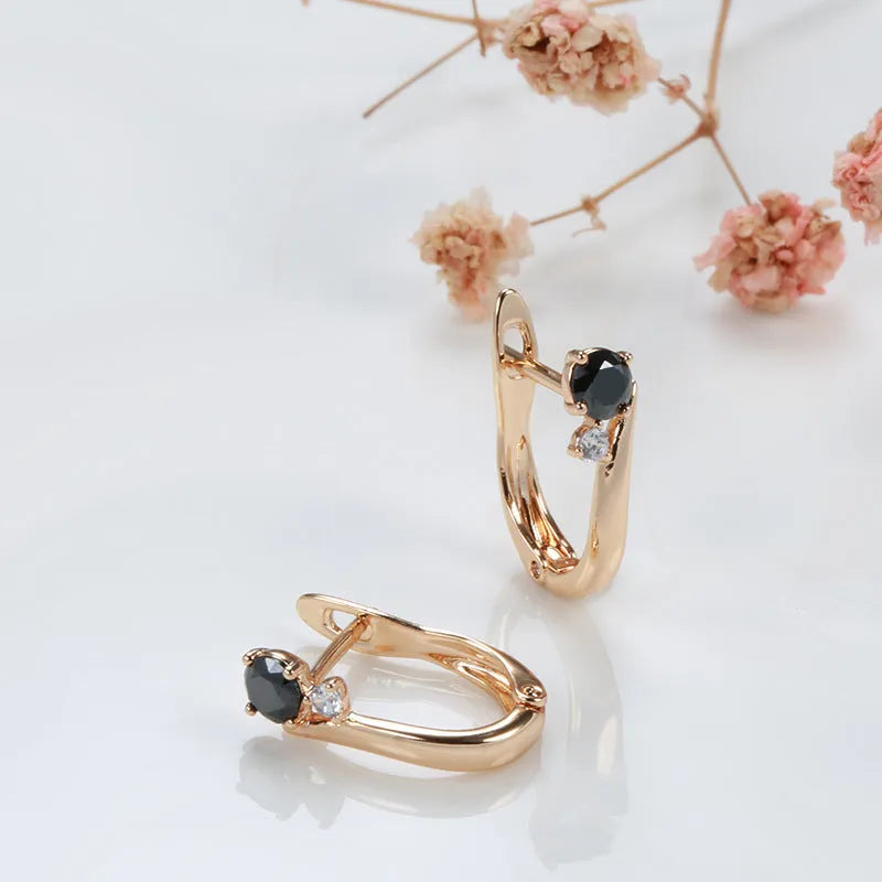 Gold geometric drop earrings with black agate stone accents and retro design