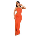 Women's solid colour long dress with one shoulder strap and pleated skirt in white, orange, or green.