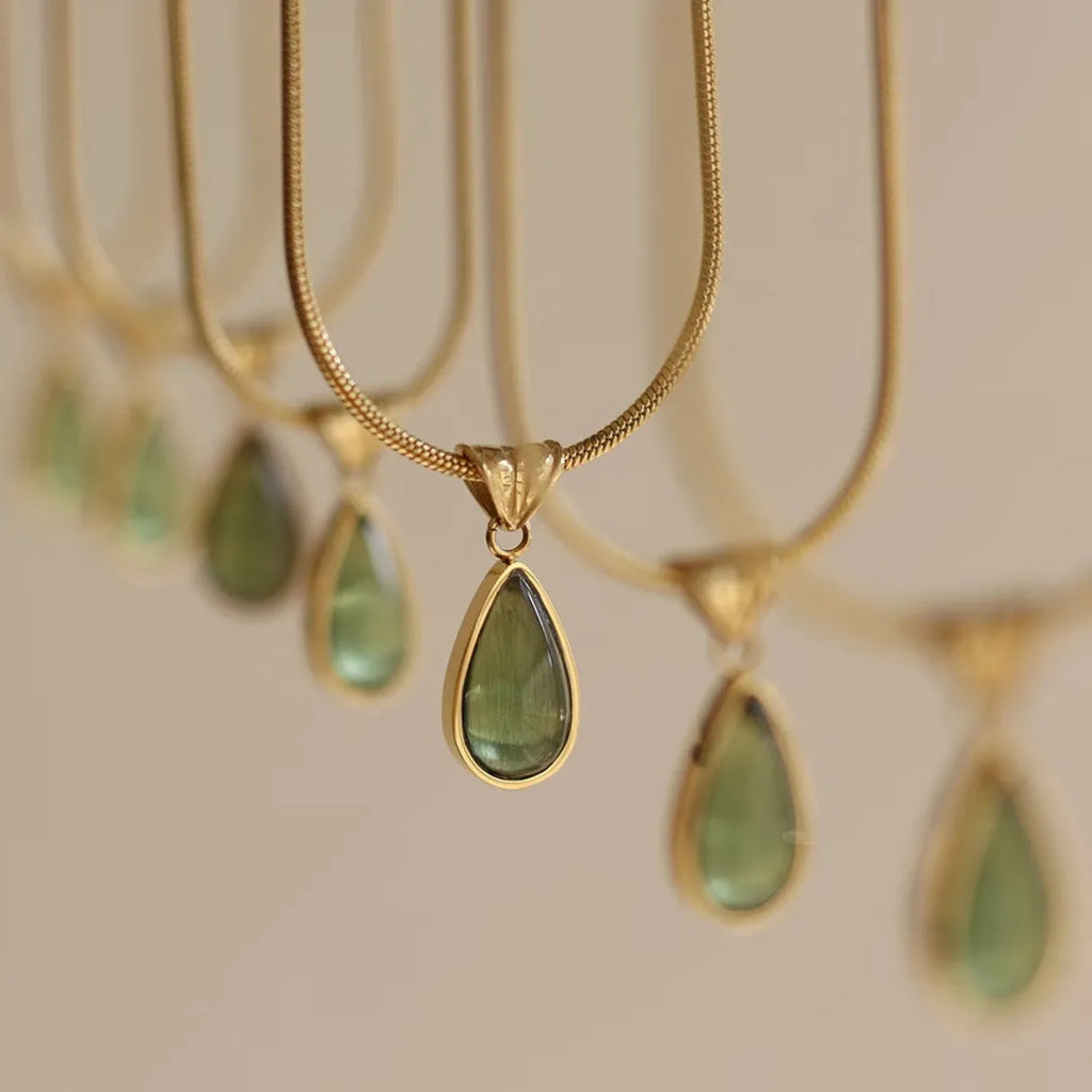 Retro water drop necklace with mixed gem inlay on a titanium steel snake bone chain in blue or green.