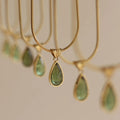 Retro water drop necklace with mixed gem inlay on a titanium steel snake bone chain in blue or green.