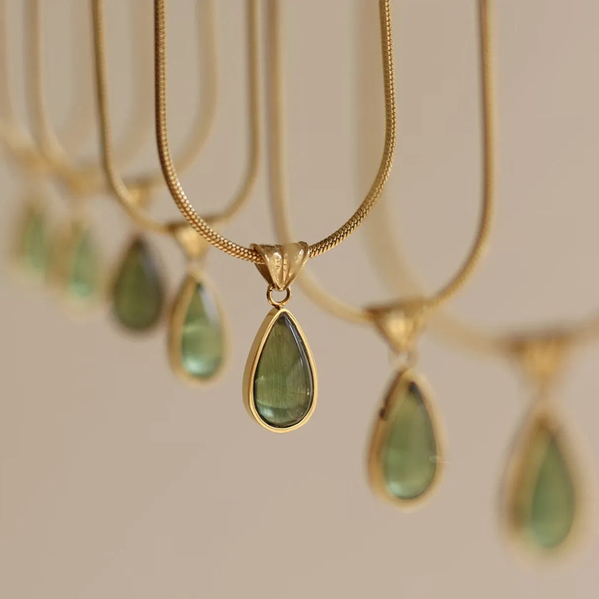 Retro water drop necklace with mixed gem inlay on a titanium steel snake bone chain in blue or green.