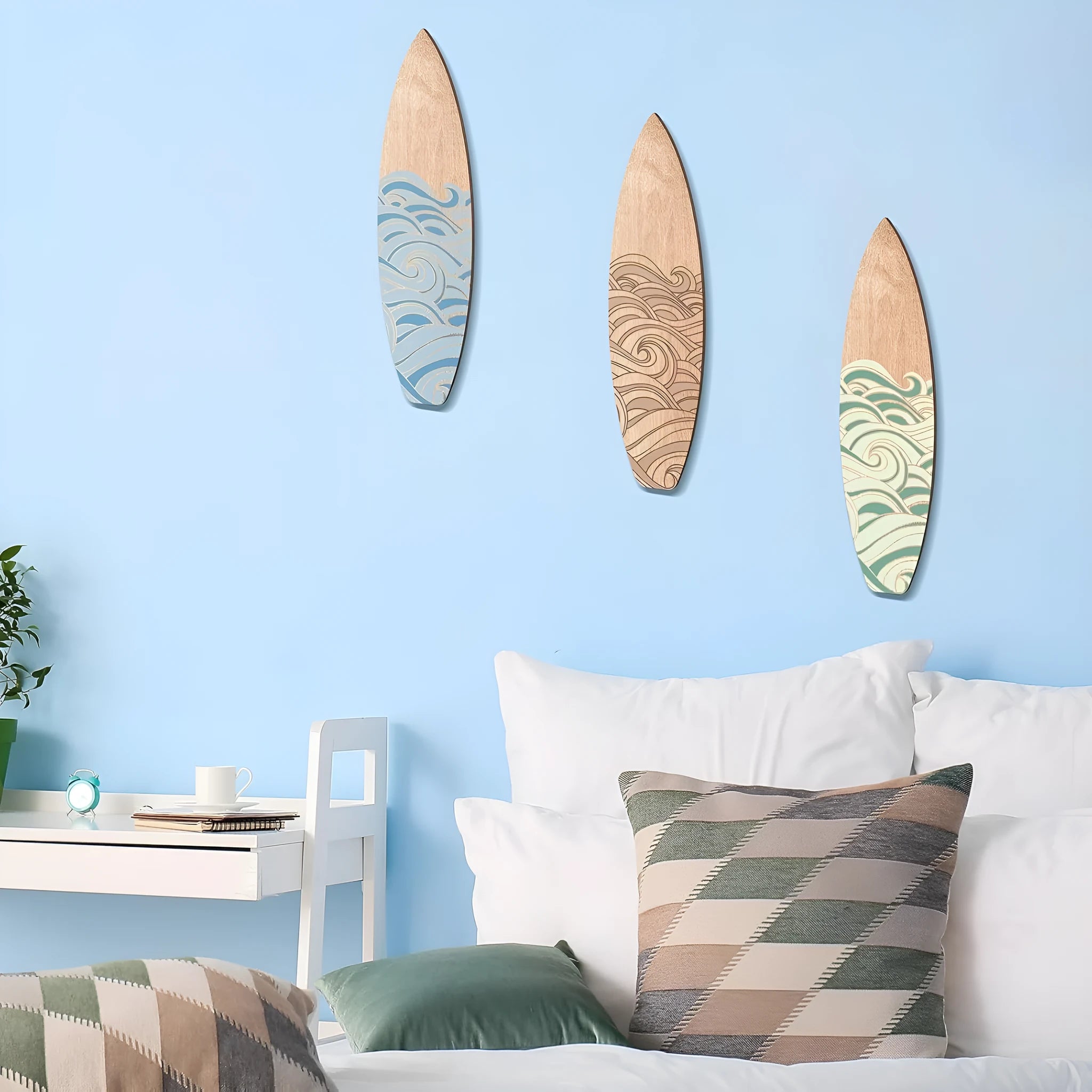 Three identical wooden surfboard-shaped wall decorations made from boxwood, shown against a plain background.