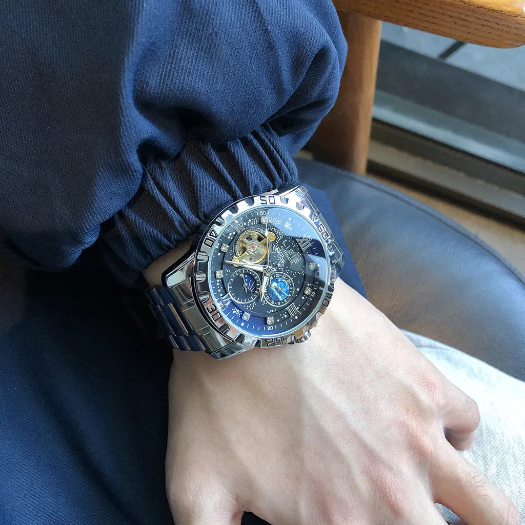 Men's silver case automatic mechanical watch with luminous hands, waterproof starry dial, and genuine leather strap