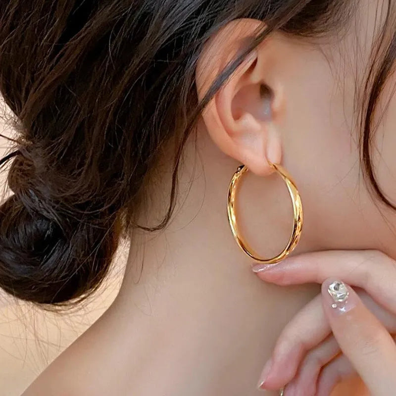 Gold and silver metal circle hoop earrings with 40mm diameter electroplated copper construction