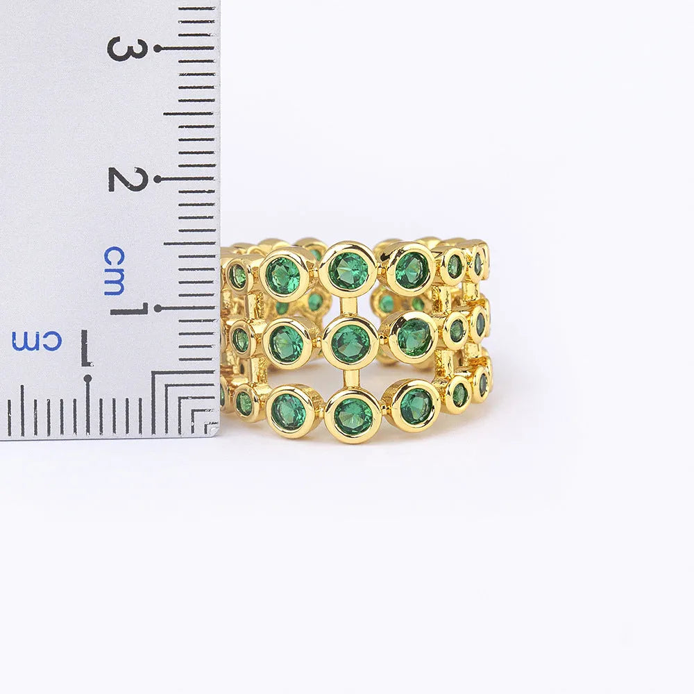 Copper wide band ring with 18K gold plating and full green zircon stones