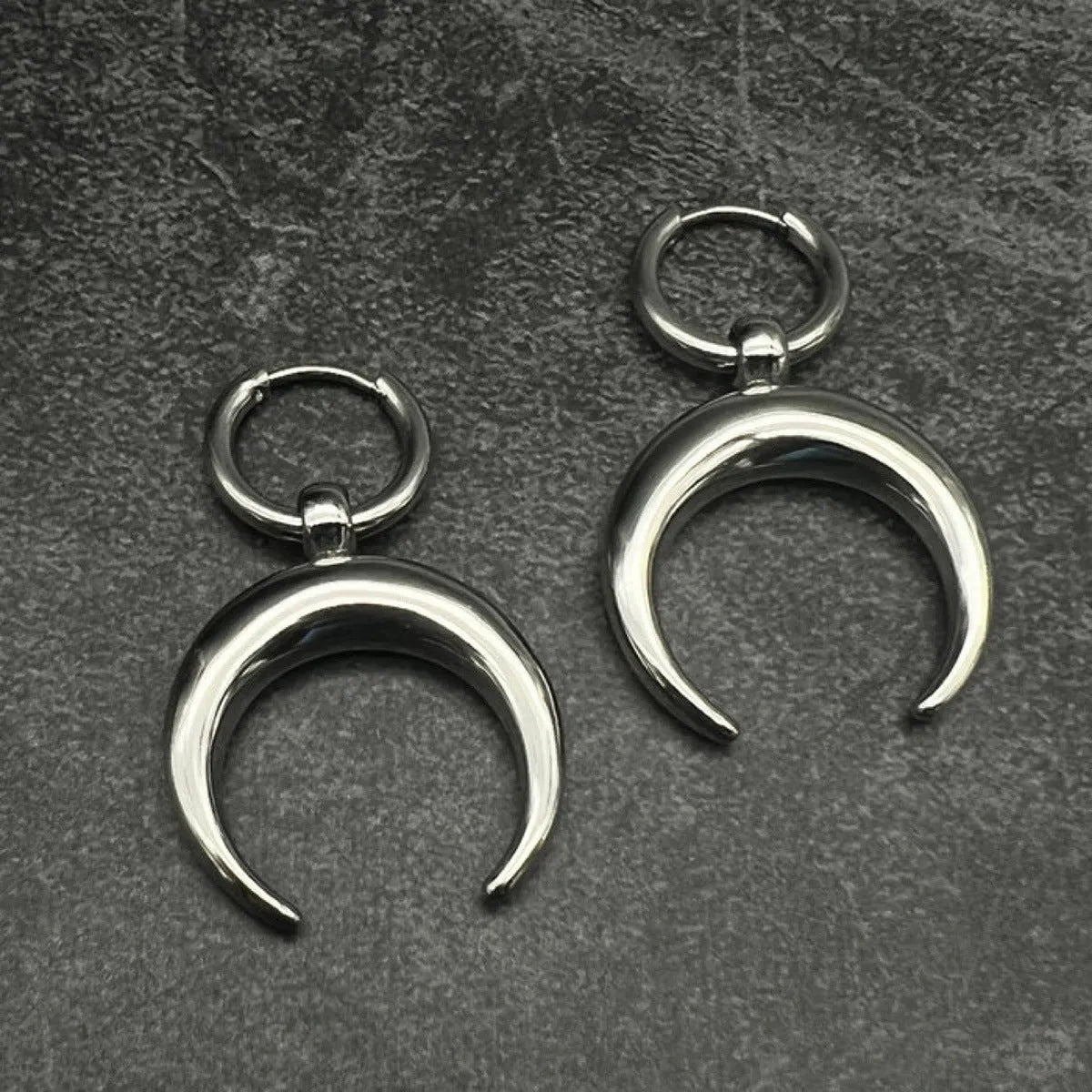 Silver gothic moon hoop earrings with geometric punk design and ear clip fastening