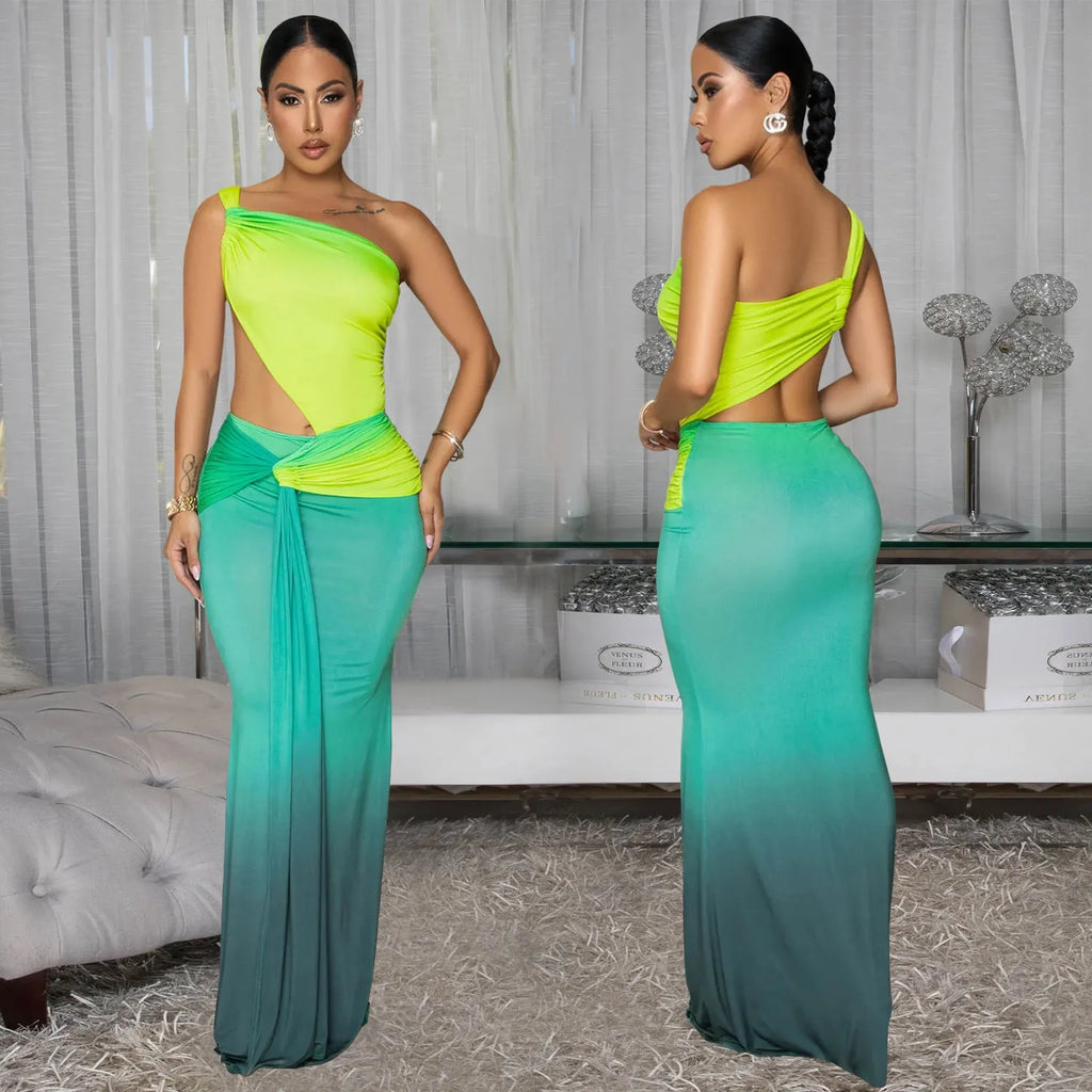 Women's gradient colour cross-shoulder long summer dress on a model, showing the oblique shoulder and one-step skirt design.