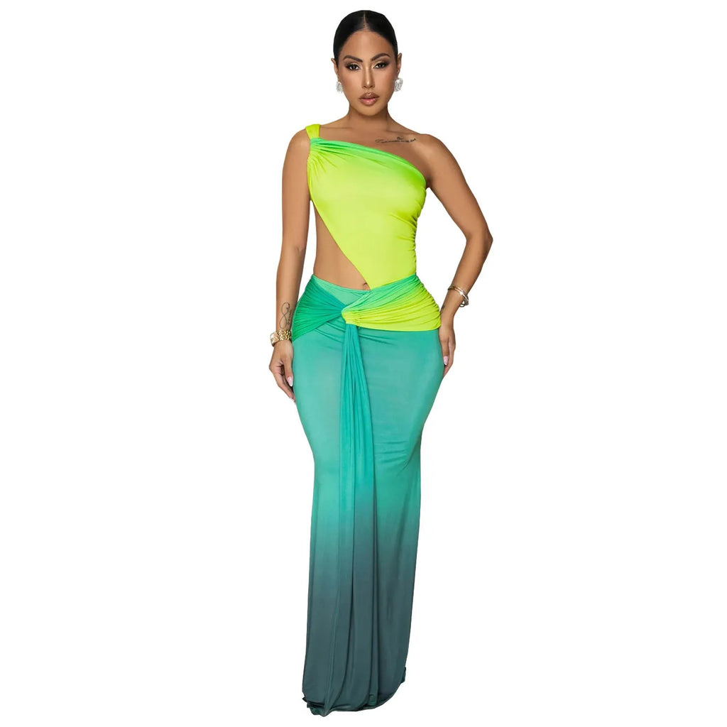 Women's gradient colour cross-shoulder long summer dress on a model, showing the oblique shoulder and one-step skirt design.
