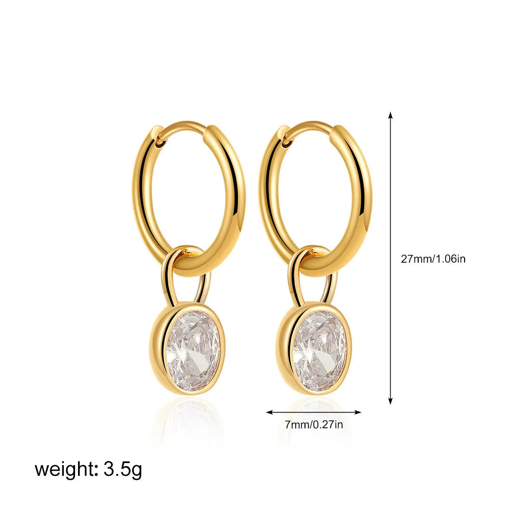 Close-up of women's retro oval zircon earrings in copper setting, showing ellipse design.