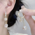 Silver tassel ball earrings with confession balloon pendant and rhinestone details on ear clips